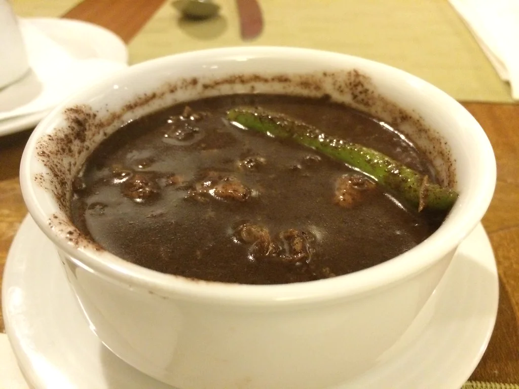 Dinuguan in a white bowl